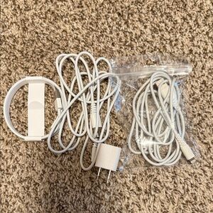 3 USB-A to Lightening Charging cables and one Apple charger block